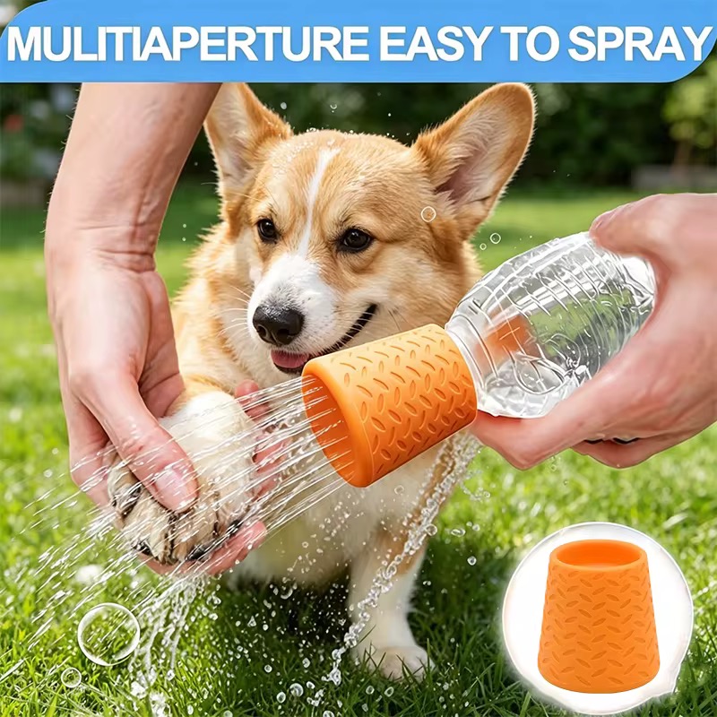 Orange silicone nozzle rinsing a corgi's paw